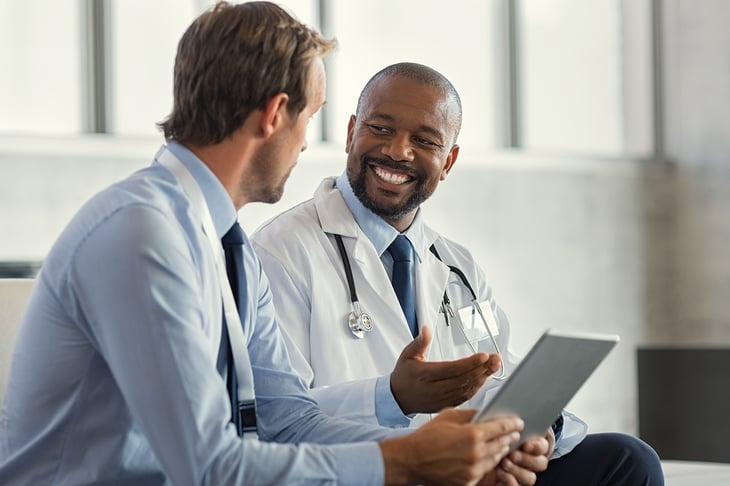 Doctors-having-discussion-about-patient-diagnosis-1189302612